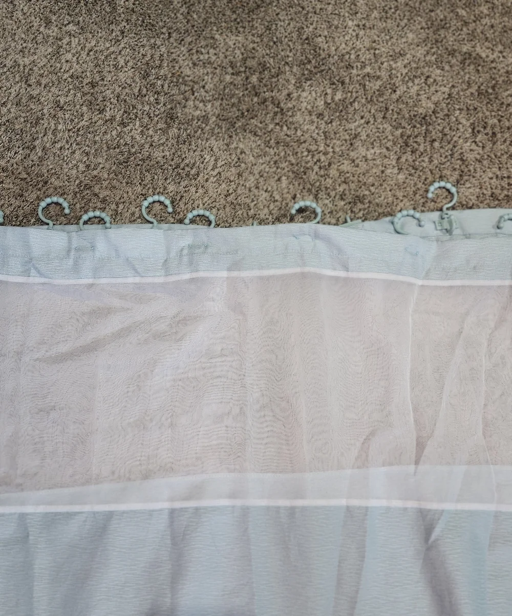 Light Green Shower Curtain With Rod Hooks Attached..